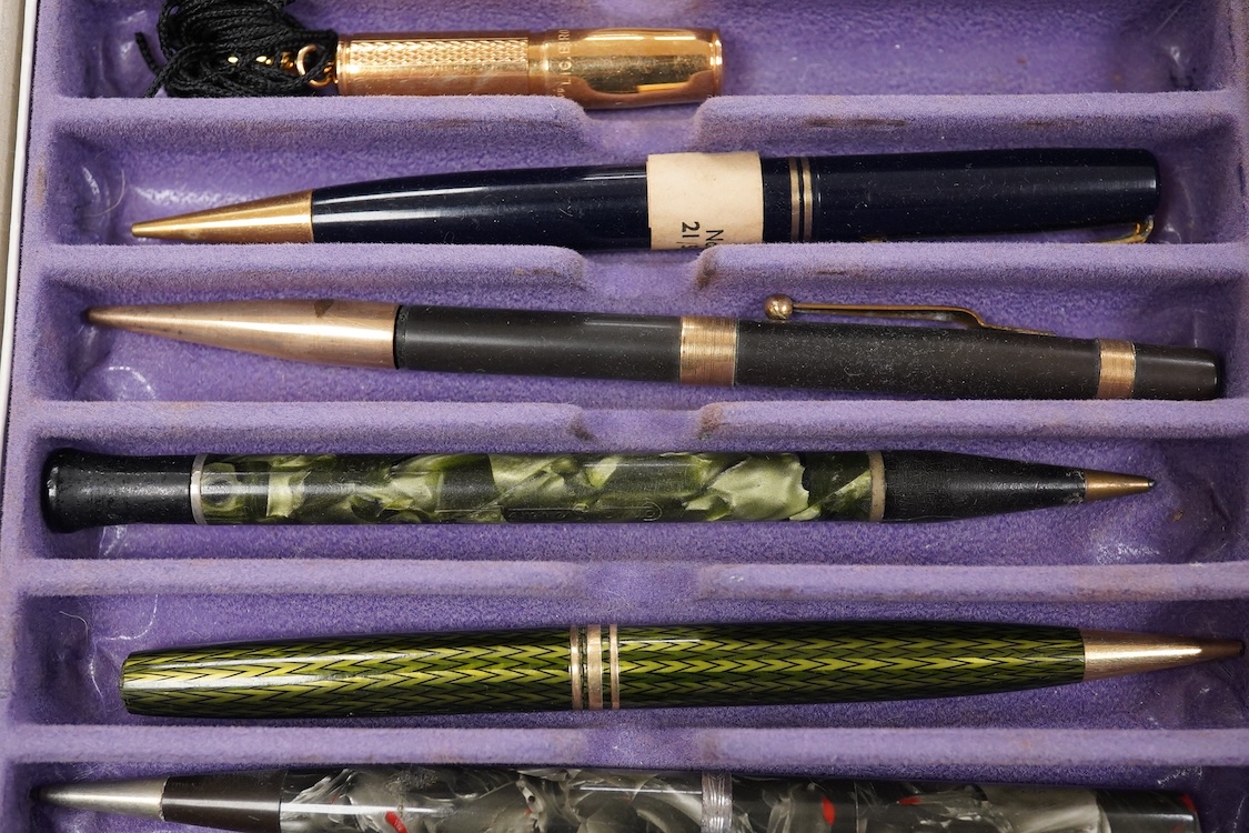 A collection of vintage pencils including an early enamel example